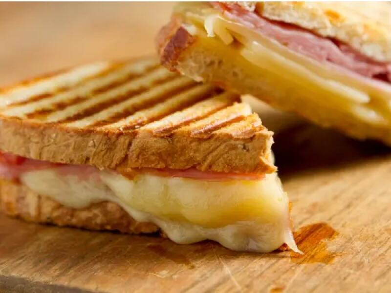 TH01_cheese-and-ham-panini-sandwiches-on-a-wooden-board-picture-id155352902 (1)